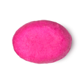 American Cream. A fuchsia pink, oval shaped solid conditioner bar.