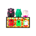 Boo Bears gift. Three monster bear bath bombs sit atop an orange chequered box featuring illustrations of themselves. Left to right: a black vampire bear, a green three-eyed monster bear, and a white ghost bear with bright pink feet.