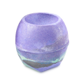 Goddess. A round bath bomb with a bowl-shaped indentation on top. It is primarily vibrant purple with a marbled band of grey and mint green around the base and coated with shimmering silver lustre.