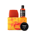 Good Karma. A rectangular box, wrapped in yellow and orange tie-dye paper, tied with orange cord and an orange gift tag.