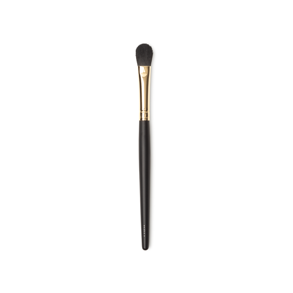 Hey Big Blender Brush. A small blending brush, with flat, tapered brown bristles and a gold and dark wooden handle.