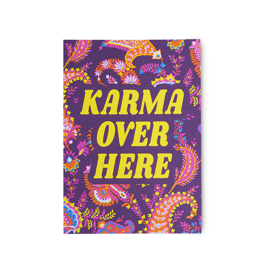 Karma Over Here. A purple postcard with a paisley-style pattern and the words "Karma Over Here" printed in yellow.
