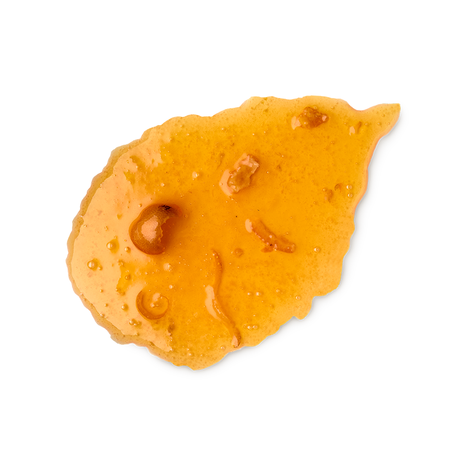 Marmalade body wash. A smudged swatch of thick, translucent orange body wash, resembling marmalade, with visible pieces of fruit zest and pulp. The texture is glossy and slightly bubbly, shown as a single smear.