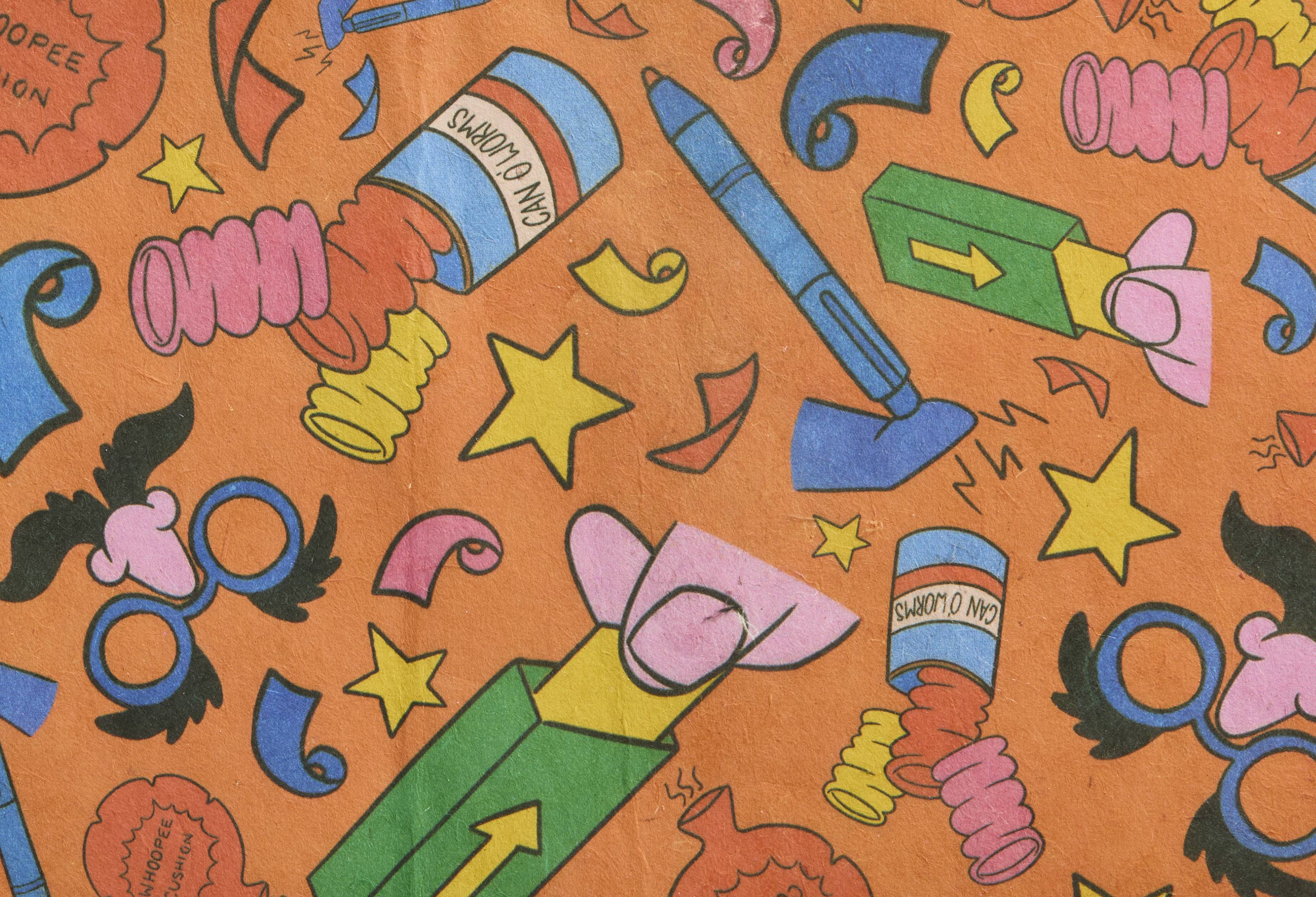 Practical Joker. A rectangular sheet of thick, gift-wrapping paper. The design is a bright orange background with lined, colourful illustrations of accessories associated with impractical jokes such as false gum, can of worms and whoopee cushions.