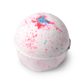 Sakura. A round bath bomb, white in colour with flecks of pink and blue, topped with a sprinkling of blue coloured coarse salt.