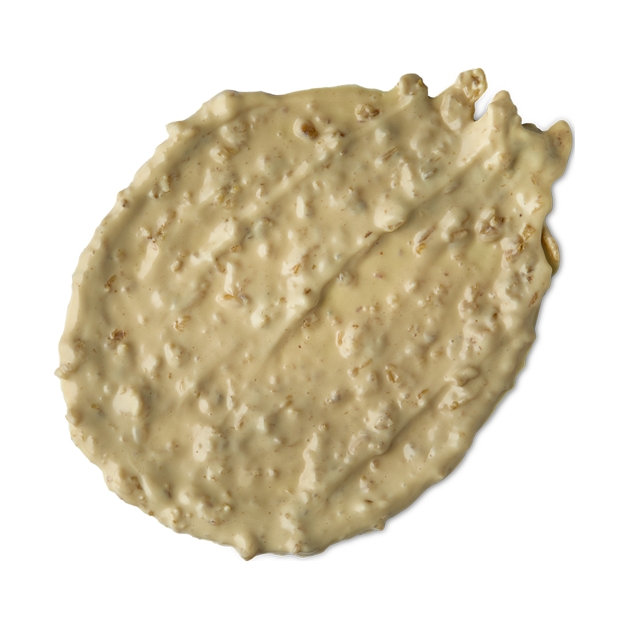 Skin Soothing Porridge. A thick swatch of creamy, pale yellow face mask with small pieces of exfoliating oats just visible.